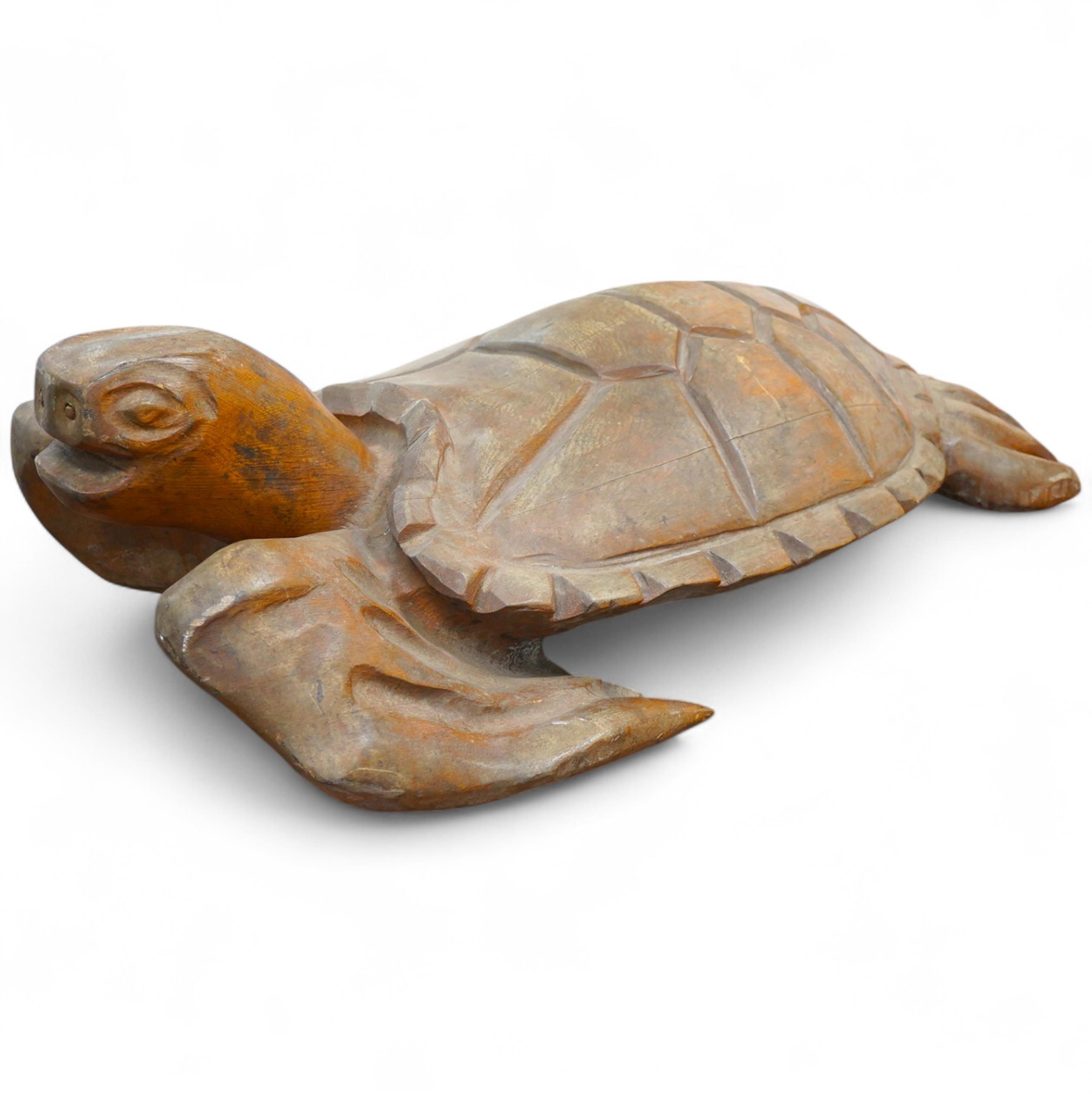 A large novelty carved weathered teak model of a green turtle